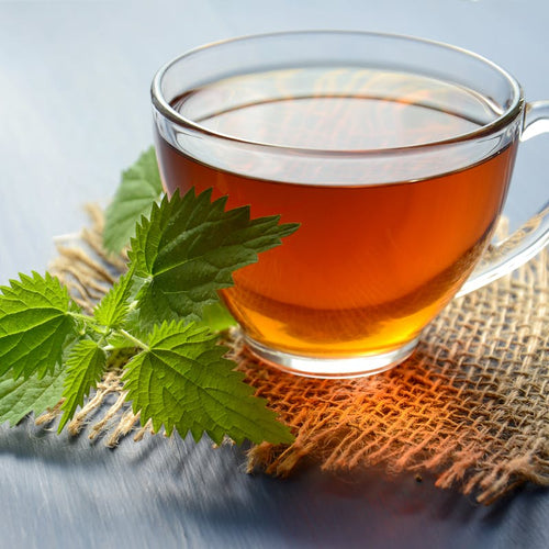Steaming cup of chamomile herbal tea