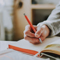 Woman journaling peacefully by window