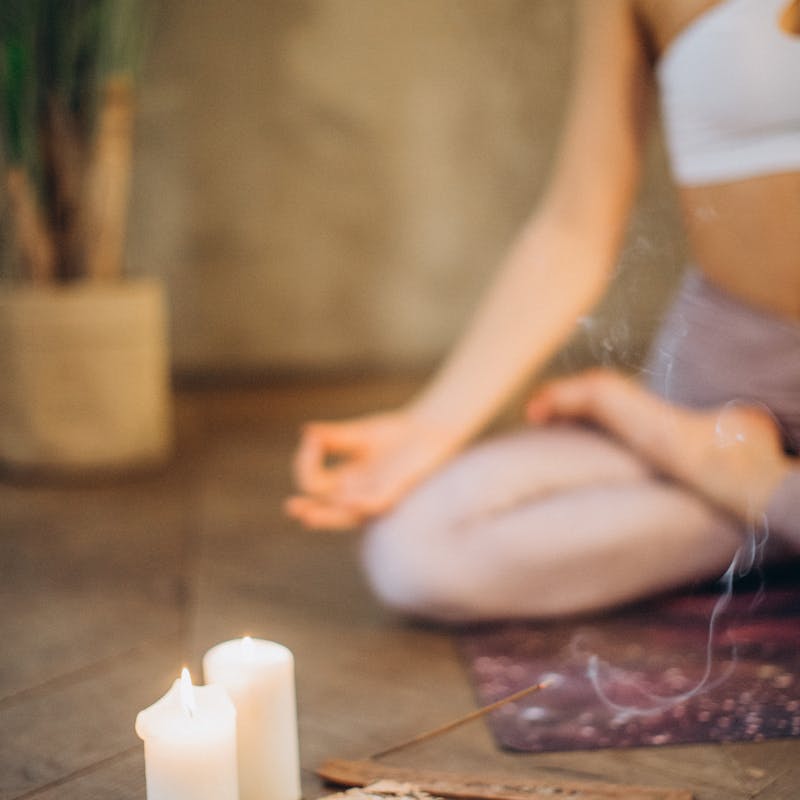 Woman meditating peacefully in morning light
